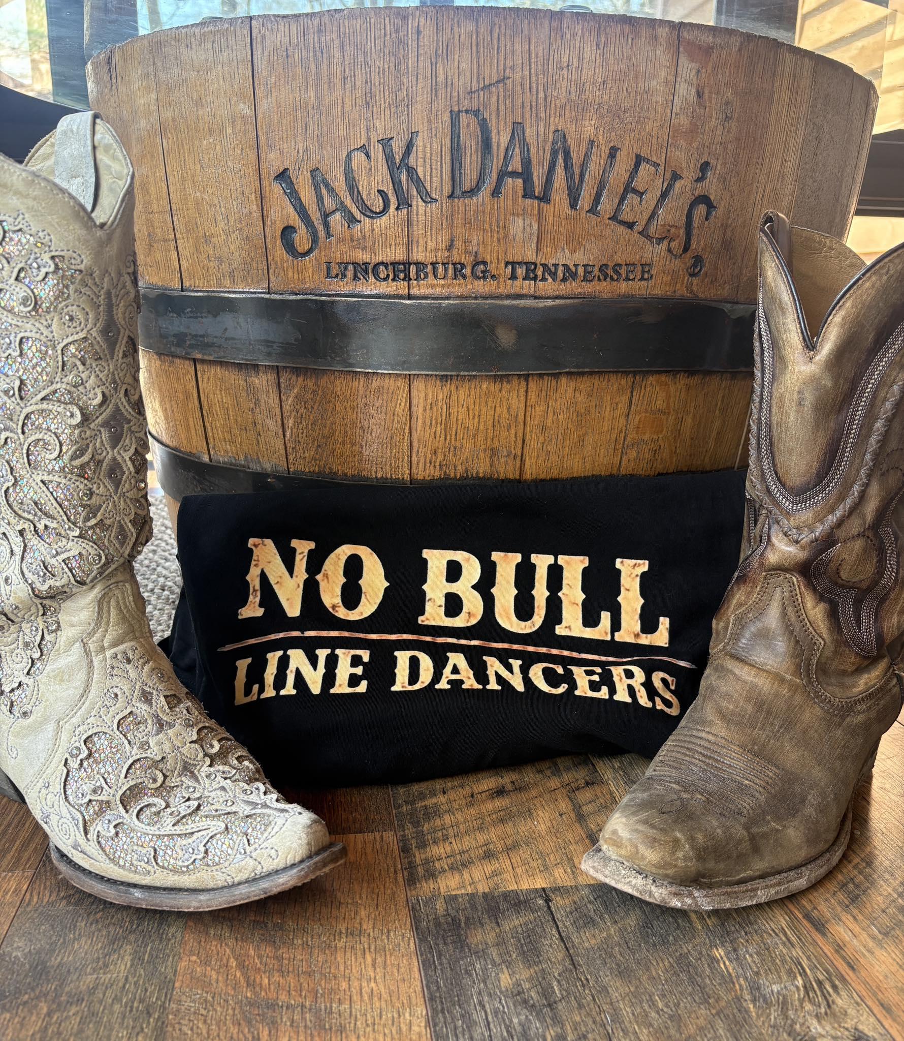No Bull Line Dancers display with boots and barrel